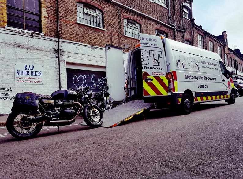 Large black bike being loaded | LBT Motorcycle Recovery