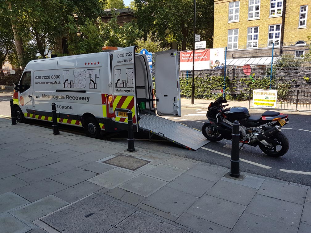 Black bike being loaded | LBT Motorcycle Recovery