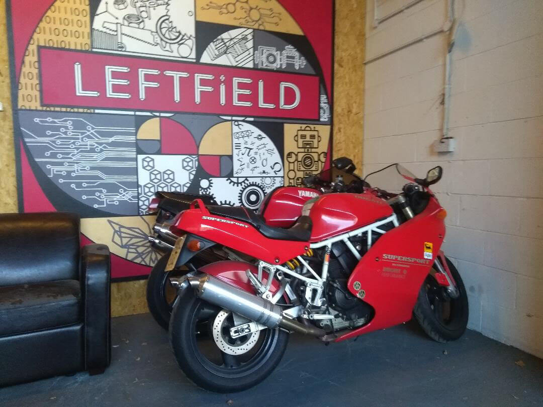Red ducati in showroom | LBT Motorcycle Recovery