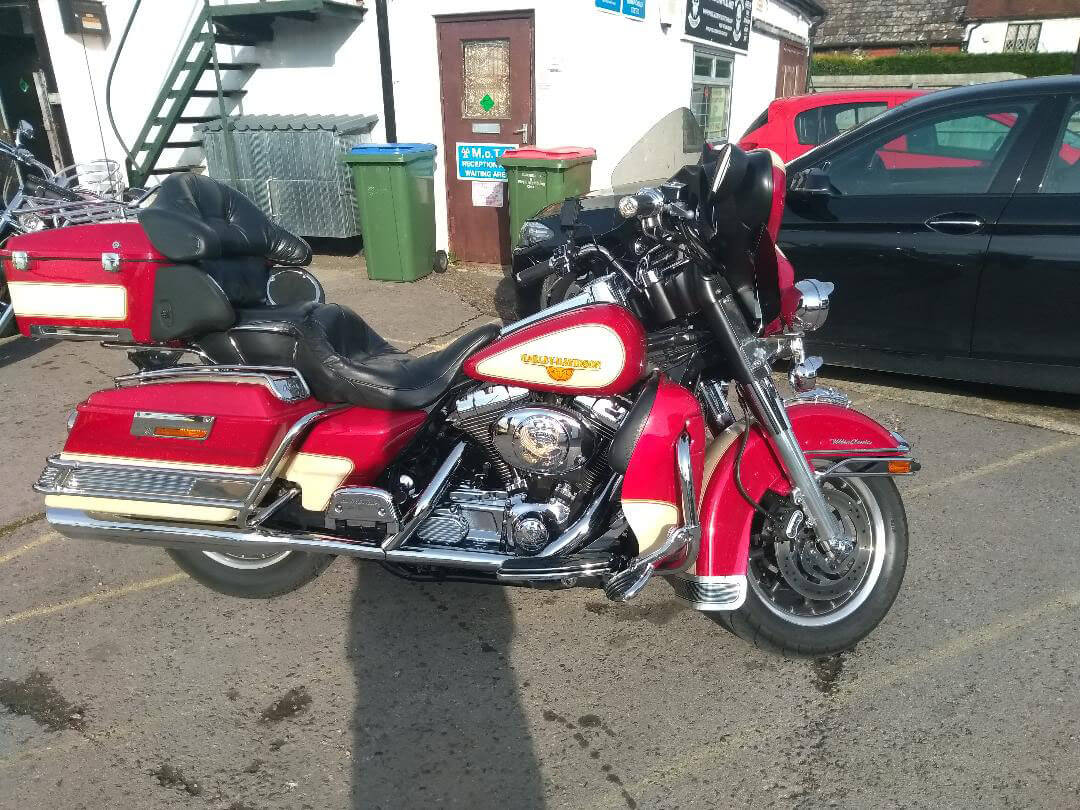 red bike with panniers | LBT Motorcycle Recovery