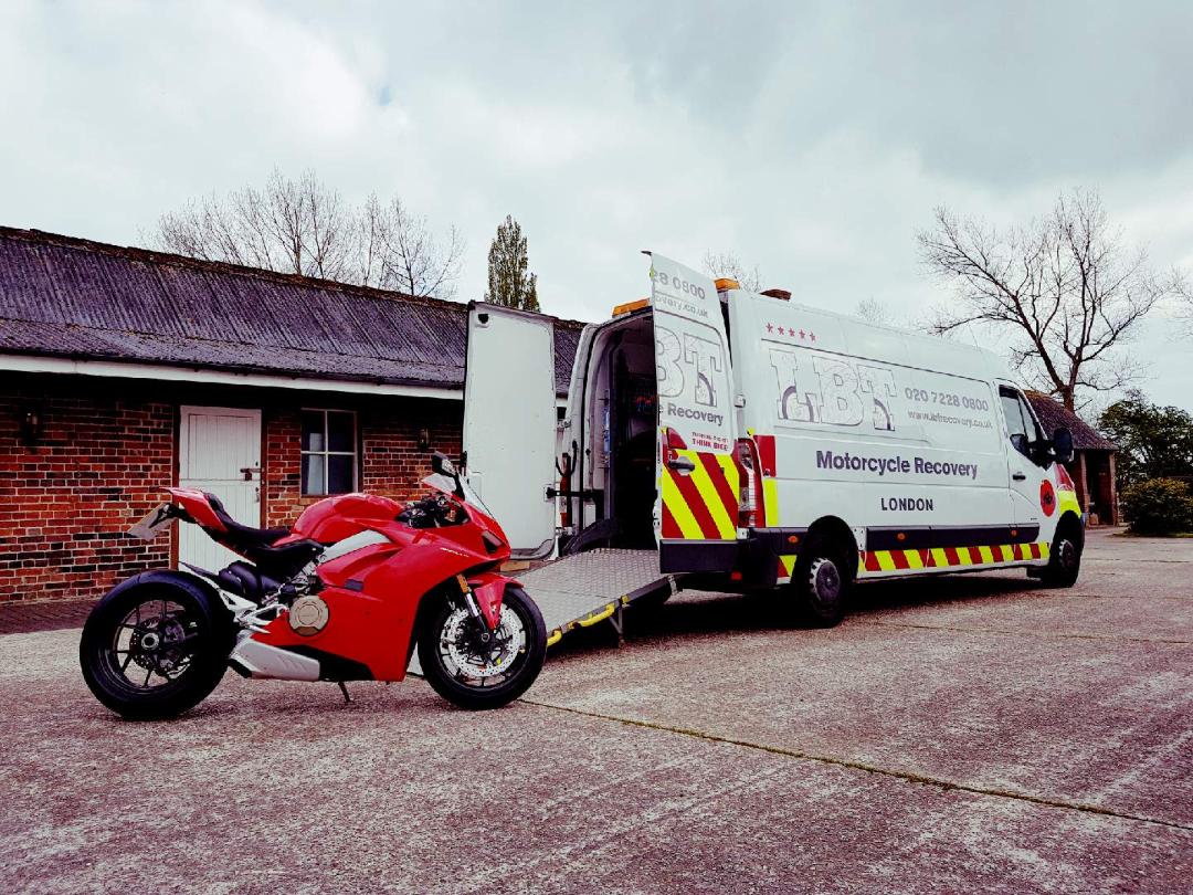 Red Ducati being loaded | LBT Motorcycle Recovery