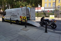 Black bike being loaded | LBT Motorcycle Recovery