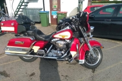 red bike with panniers | LBT Motorcycle Recovery